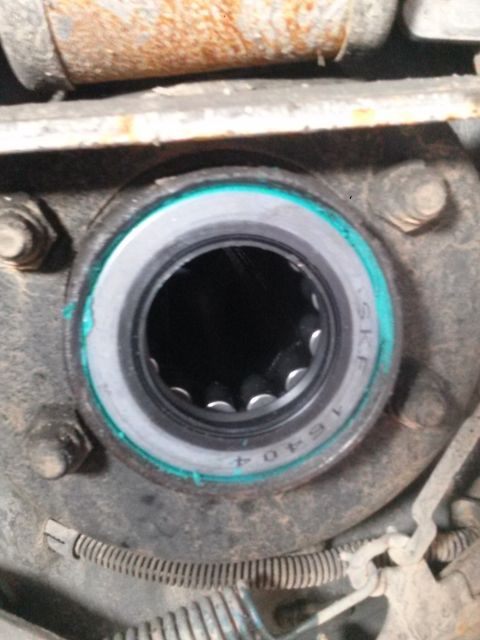 1996 Ford Bronco - A close-up view shows a wheel bearing assembly with visible splines inside the hub. Text on the bearing reads "SKF 16404".
