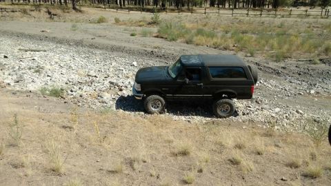 1995 Ford Bronco - This 1995 Ford Bronco is navigating a rough, rocky terrain.