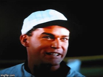 1995 Mercury Grand Marquis - Close-up of a man's face wearing a white baseball cap.
