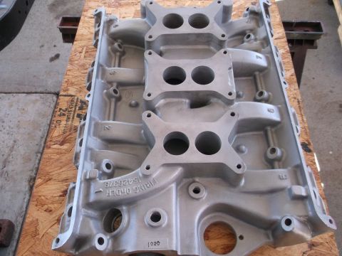 1963 Ford Galaxie - Close-up of an aluminum engine intake manifold, showing its ports and mounting surfaces.