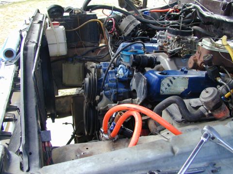 1979 Ford Bronco - Close-up view of a vehicle's engine bay, showing various components and wiring.