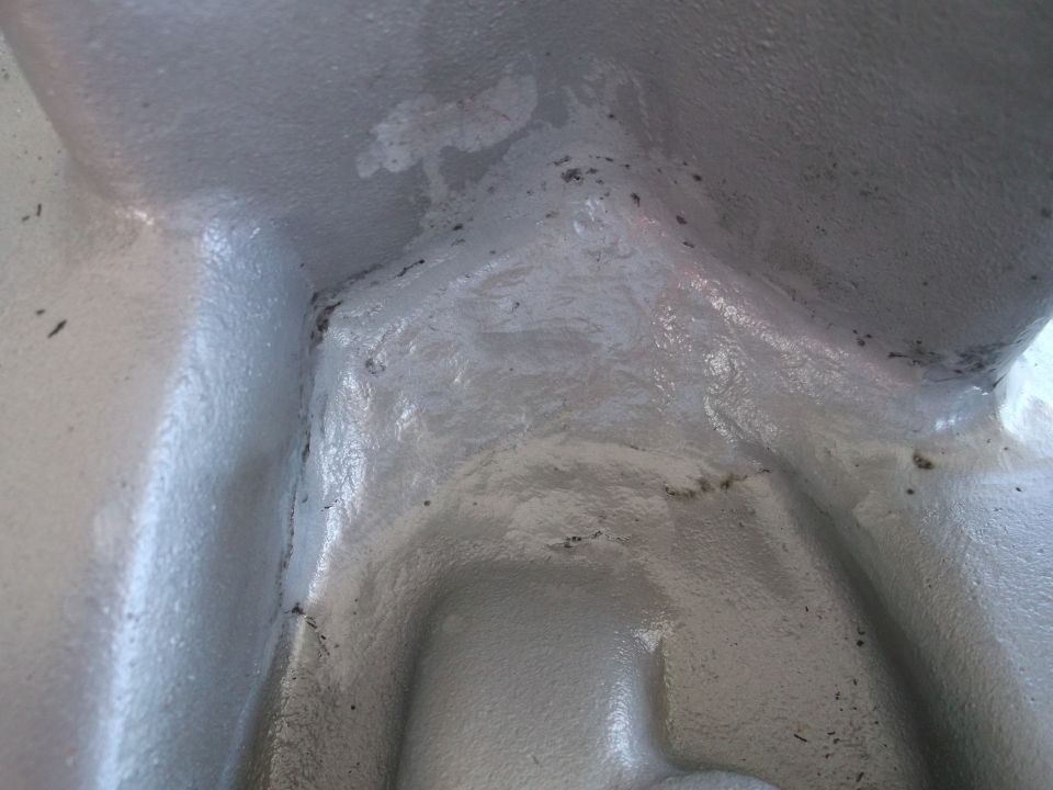 Close-up of a gray engine block casting with some discoloration