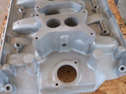 1963 Ford Galaxie - Close-up of an aluminum intake manifold, likely for a V8 engine.