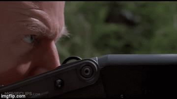 1995 Mercury Grand Marquis - A hand is shown reaching for the door handle of a vehicle, with greenery in the background.
