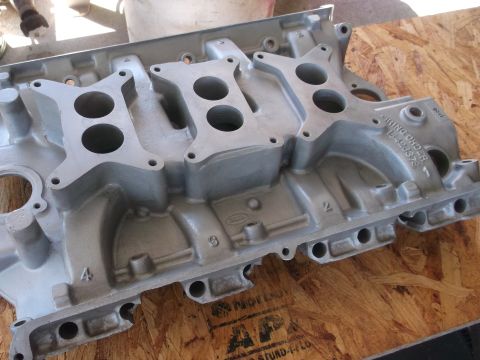 1963 Ford Galaxie - Close-up of an intake manifold, showing its casting details and intake ports.