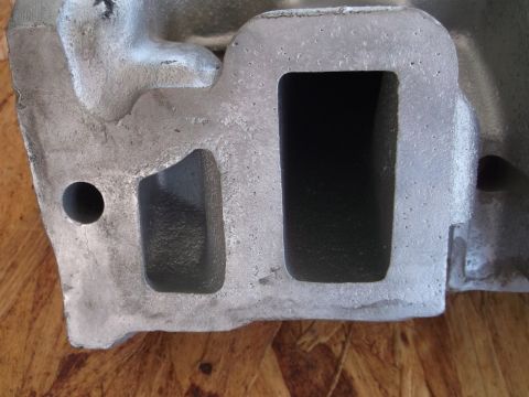 1963 Ford Galaxie - Close-up of an engine component, showing its cast metal texture and internal passages.