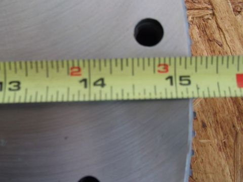 1963 Ford Galaxie - A close-up of a measuring tape laid across a metal surface, indicating measurements from 13 to 15 inches.