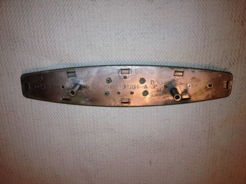 1968 Mercury Cougar - This is the underside of a car emblem, showing its mounting hardware and a part number.