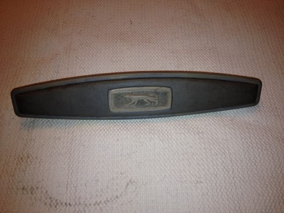 Mercury Cougar emblem on dark gray trim