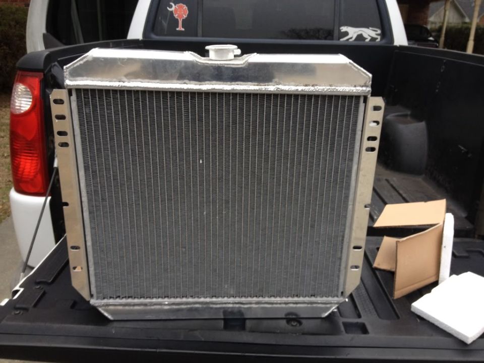 Aluminum radiator sitting in the bed of a pickup truck