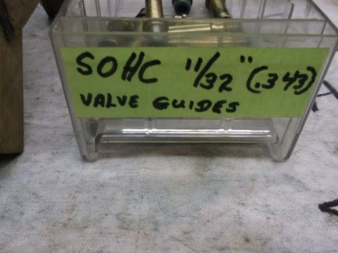 1963 Ford Galaxie - SOHC valve guides are organized in a clear plastic container with a handwritten label.