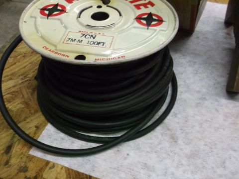 1963 Ford Galaxie - A spool of black hose with manufacturing details visible on the label.