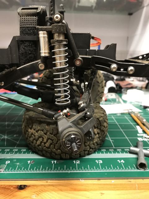 1989 Ford Bronco - Close-up of an RC car's suspension system, showing the shock and linkage components.