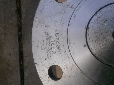 1996 Ford Bronco - Close-up of a metal component with part numbers stamped into its surface.