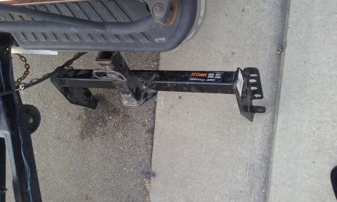 1995 Ford Bronco - A CURT brand trailer hitch receiver is attached to the rear of a vehicle.