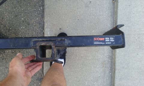 1995 Ford Bronco - A CURT trailer hitch receiver is shown, with readable text and branding visible on the side.