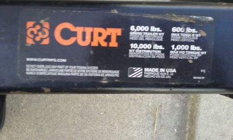 1995 Ford Bronco - Hitch receiver label shows weight capacities and manufacturing origin.