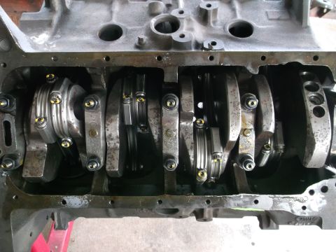 1967 Ford Mustang - Close-up view of an engine's internal components, showing the crankshaft and connecting rods.