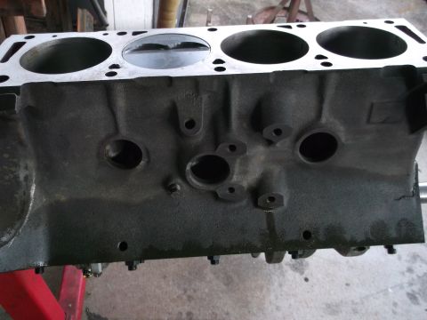 1967 Ford Mustang - Close-up of an engine block, showing cylinder bores and mounting points.