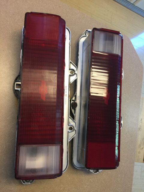 1975 Chevrolet Chevelle - A close-up view of two vehicle tail lights, likely for replacement or comparison.