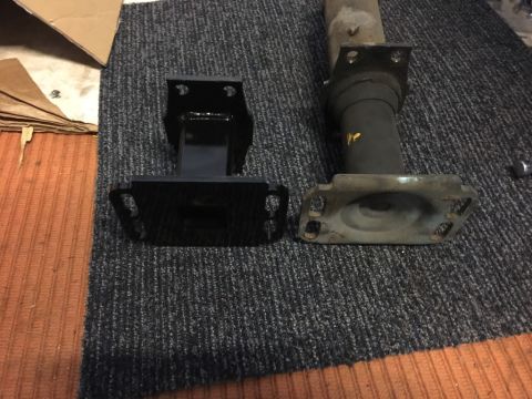 1975 Chevrolet Chevelle - A new black car part is shown next to an older, used part for comparison.