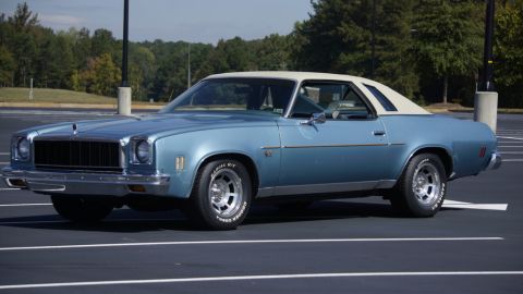 1975 Chevrolet Chevelle - This coupe features a two-tone paint scheme with a light blue body and a white vinyl roof.