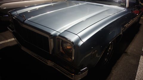 1975 Chevrolet Chevelle - The front quarter panel and grille of a classic Chevrolet sedan are visible in this close-up shot.