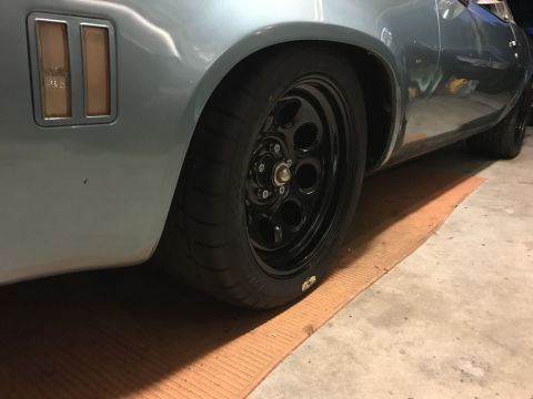 1975 Chevrolet Chevelle - A close-up view of the rear wheel well and side panel of a classic car.