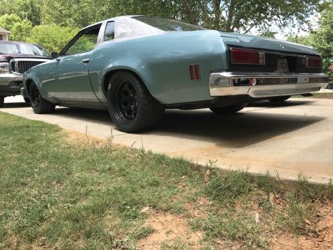 1975 Chevrolet Chevelle - This 1975 Chevrolet Chevelle coupe is viewed from the rear 3/4 angle, its blue paint and black wheels.