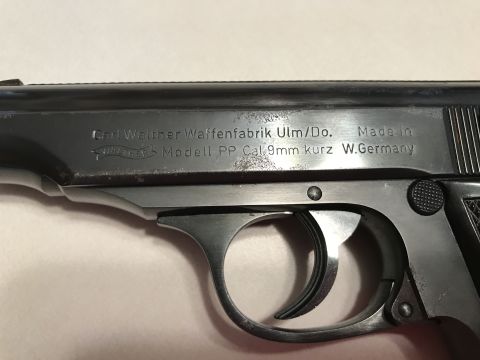 1989 Ford Bronco - Close-up view of the slide markings on a Walther PP pistol, indicating its origin and caliber.