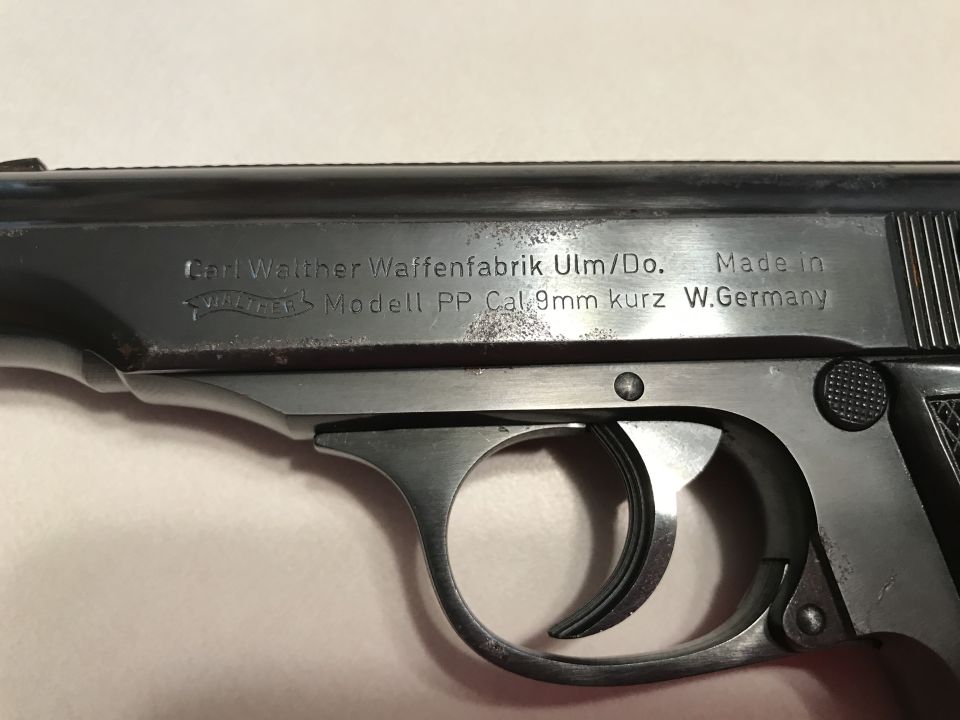 Close-up of a Walther PP pistol slide with markings: Carl Walther Waffenfabrik Ulm/Do. Made in W.Germany, Modell PP Cal. 9mm kurz