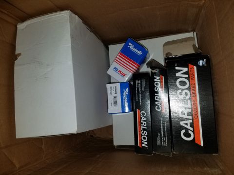 1971 Ford Mustang - A box filled with various automotive brake parts, including Carlson brake parts and Raybestos PG Plus brake pads.