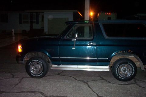 1995 Ford Bronco - This 1995 Ford Bronco is seen from the side at night.