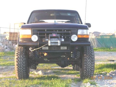 1994 Ford Bronco - front shot. this is with about 9 to 10" lift over stock. it is defintely going to require some sawzall work