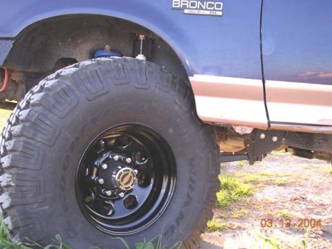 1994 Ford Bronco - this shows how much I will have to cut. this is no where near how much travel i can get out of this set up. I am charging up both batteries…