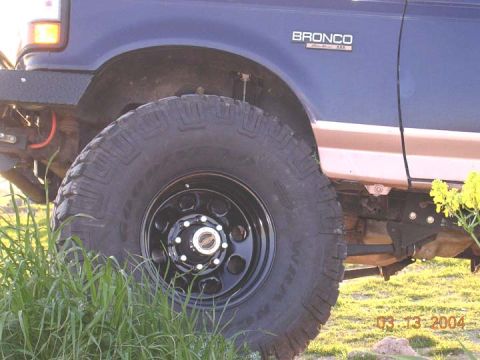 1994 Ford Bronco - Close-up of a 1994 Ford Bronco's side, highlighting the fender and tire.