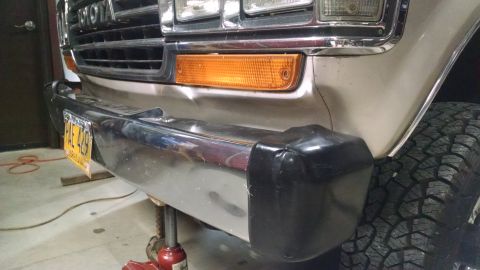 1988 Toyota Land Cruiser - The front bumper is bent, and all 4 end caps are damaged.