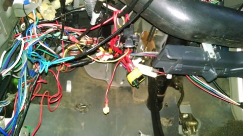 1988 Toyota Land Cruiser - There are at least 5 aftermarket systems hacked into the dash wiring below the column, but some of them are abandoned.