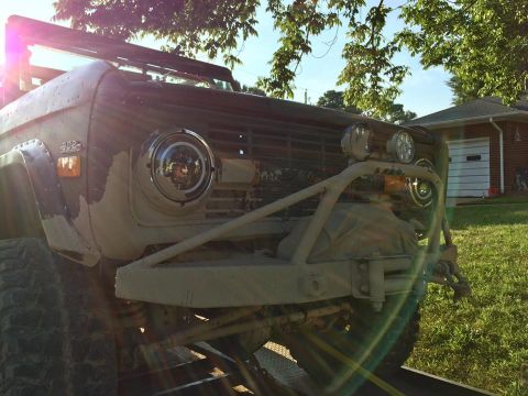 1972 Ford Bronco - This modified Ford Bronco features a custom front bumper and winch, with a visible "302" badge on the fender.