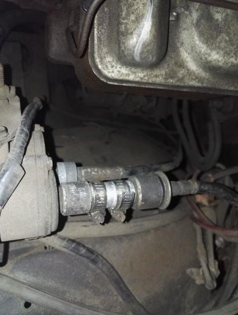 1974 Ford Ranchero - Close-up view of a vehicle's fuel filter and associated hoses, secured with hose clamps.