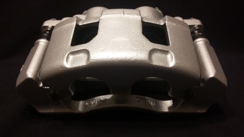 Silver brake caliper with visible text "407 7310"