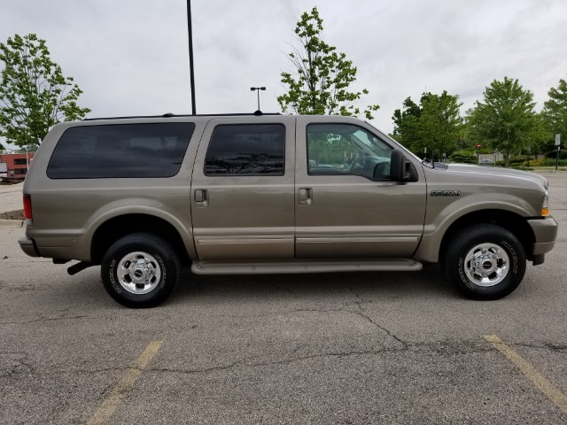 Side view of a tan 2003 Ford Excursion
