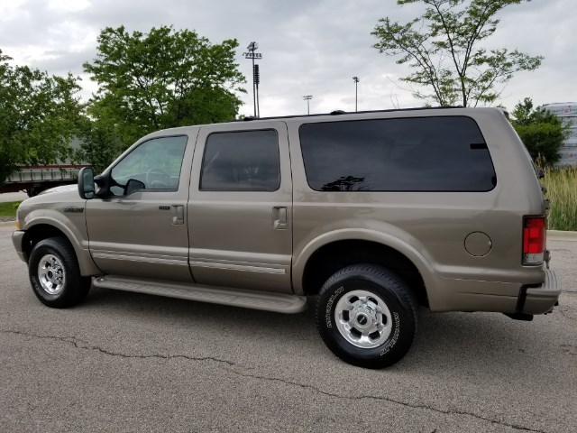 Tan 2003 Ford Excursion side view