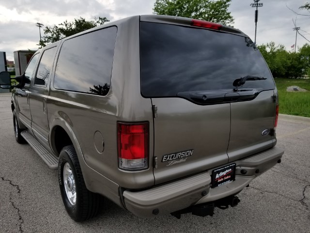 Rear view of a 2003 Ford Excursion SUV parked on asphalt
