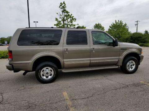 2003 Ford Excursion - Side view of a tan 2003 Ford Excursion SUV.