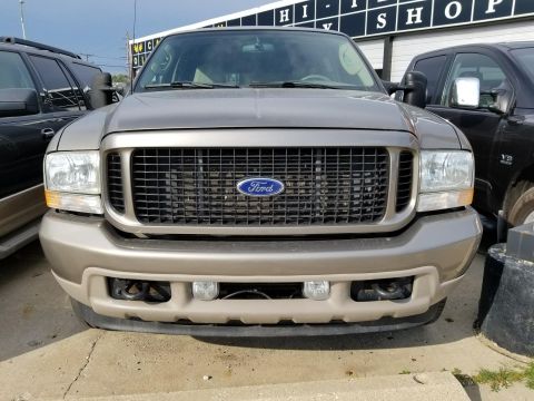 2003 Ford Excursion - Front view of a 2003 Ford Excursion, showing its distinctive grille and headlights.