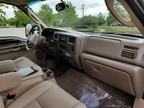 2003 Ford Excursion - Interior view of a 2003 Ford Excursion, highlighting the dashboard and seating.