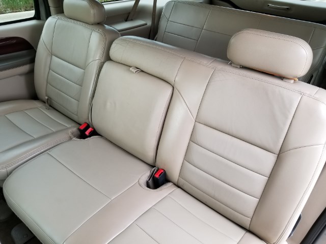 Tan leather seats and headrests in a 2003 Ford Excursion interior