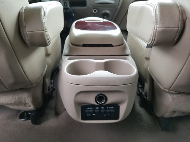 2003 Ford Excursion interior center console with dual cup holders and climate controls