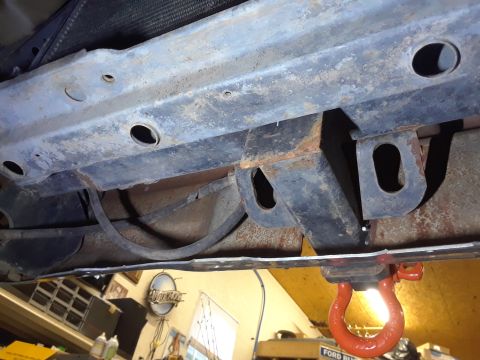 1985 Ford Bronco - Close-up view of the undercarriage, focusing on the frame and hitch components.